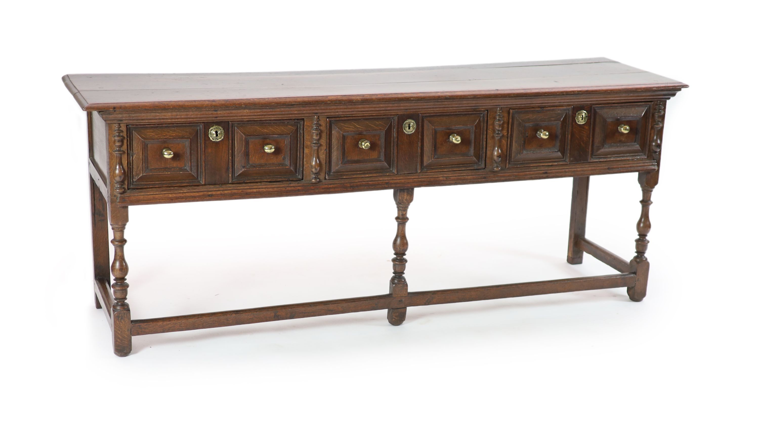 A late 17th century oak low dresser, H 81cm. W 205cm. D 54cm.